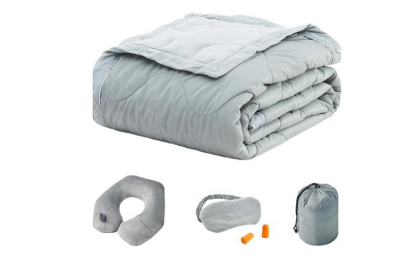 travel pillow, blanket, eye mask, and earplugs